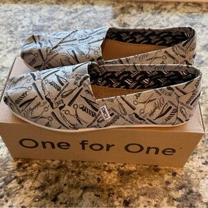 TOMS Black and Tan Graphic Slip-Ons